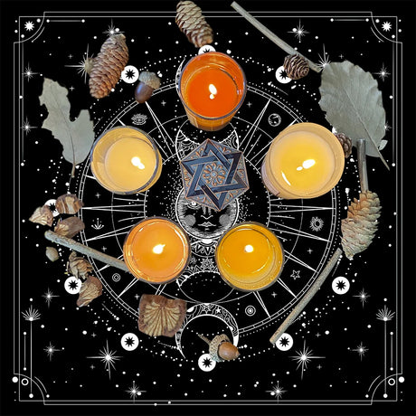 Wiccan or pagan altar setup with candles, crystals, and nature elements on a black background.