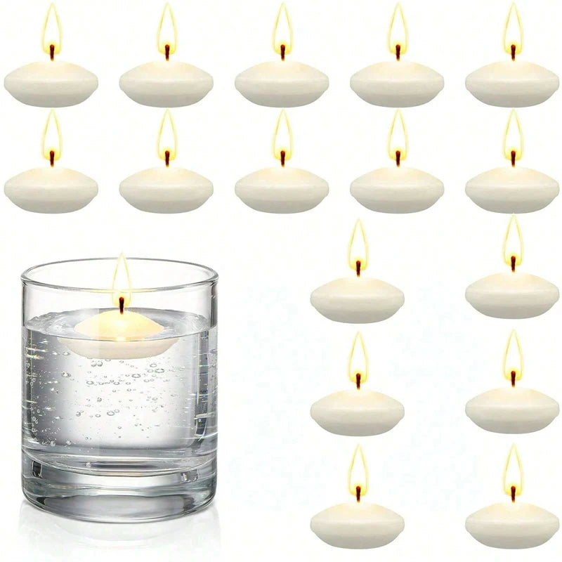 White floating candles with a glass of water on a white background