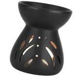 Black ceramic oil burner with cut-out designs on a white background