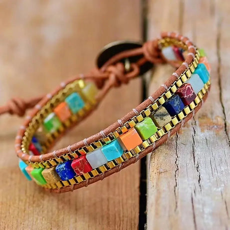 Colorful beaded bracelet on a wooden surface