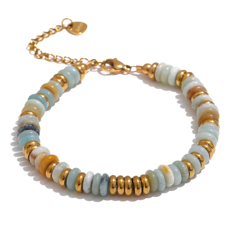 Bracelet with gold and multicolored beads on a white background