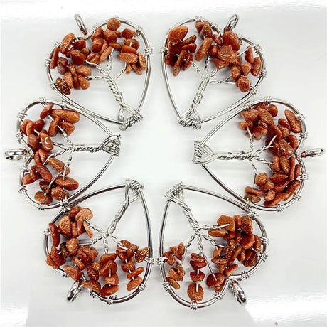 Five identical tree-shaped pendants with brown stones on a white background