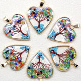 Set of heart-shaped beaded pendants on a white background