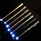 Set of decorative wands with glowing tips on a dark background