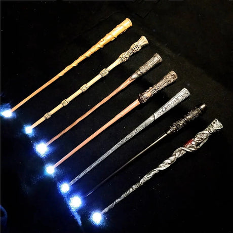 Set of decorative wands with glowing tips on a dark background