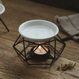 White ceramic bowl with a black geometric holder on a wooden surface