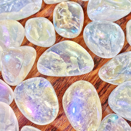 Translucent stones with iridescent properties on a wooden surface