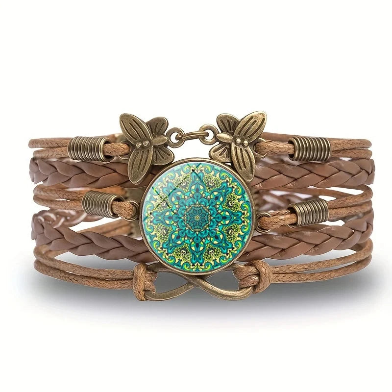 Brown braided bracelet with a blue and gold circular charm on a white background