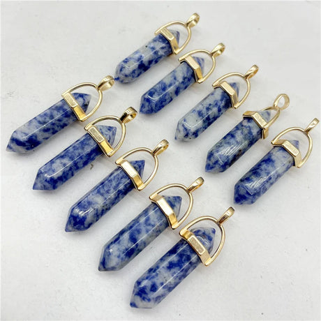 Blue crystal pendants with gold accents on a white background