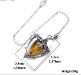Jewelry with a tiger's eye stone and silver chain, showing measurements and weight on a white background.