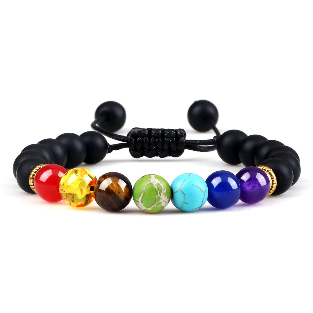 Multicolored beaded bracelet with black cord on a white background