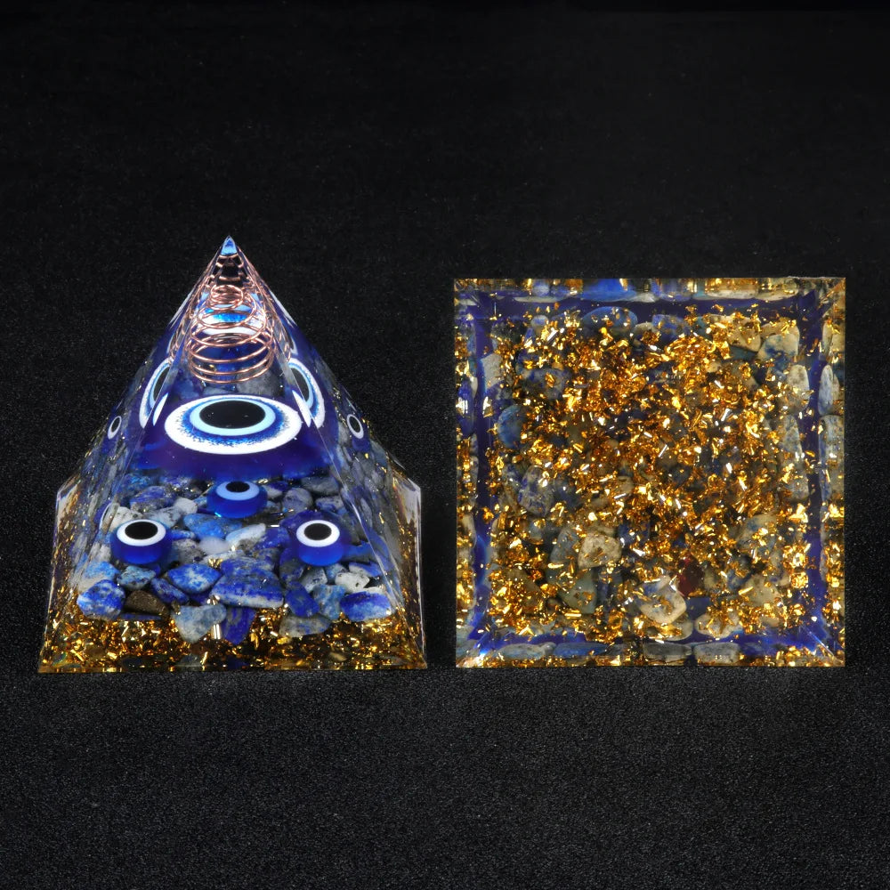 Pyramid-shaped object with blue and gold elements on a black background