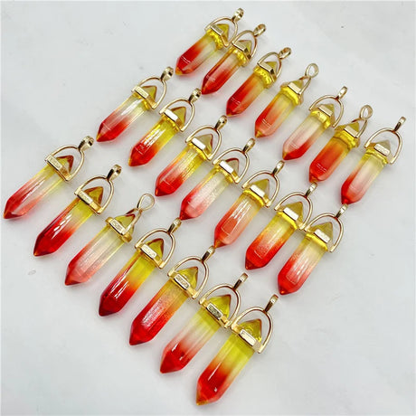 Row of colorful crystal pendants with gold accents on a white background