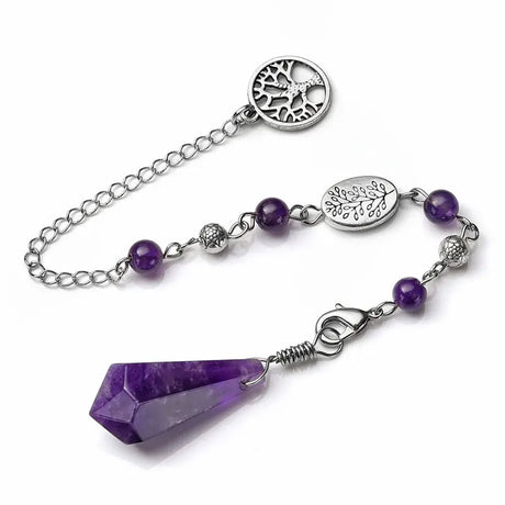 Purple crystal pendant on a silver chain with purple beads against a white background