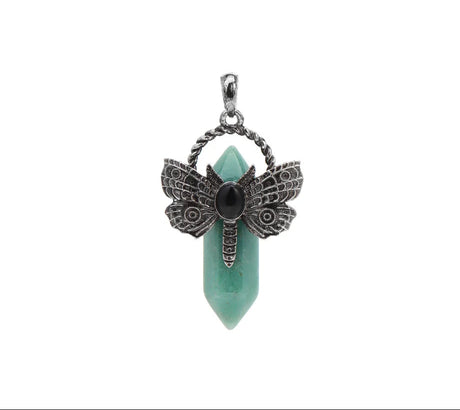 Jewelry pendant with butterfly design and green stone on a white background