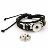 Black braided bracelet with silver beads on a white background