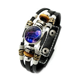 Multistrand bracelet with a central purple stone featuring a wolf design on a white background.