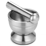 Stainless steel mortar and pestle on a white background