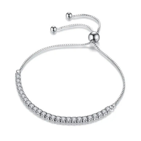 Silver bracelet with clear stones on a white background