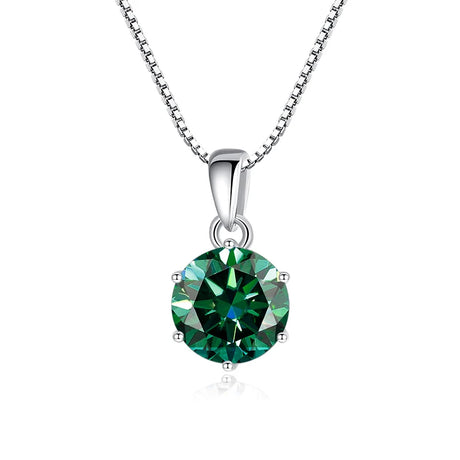 Green gemstone pendant on a silver chain against a white background