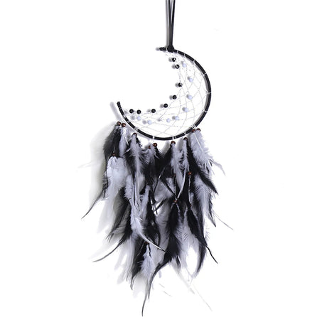 Black and white dreamcatcher with feathers on a white background
