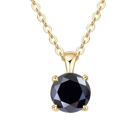 Gold necklace with a black gemstone pendant on a white background