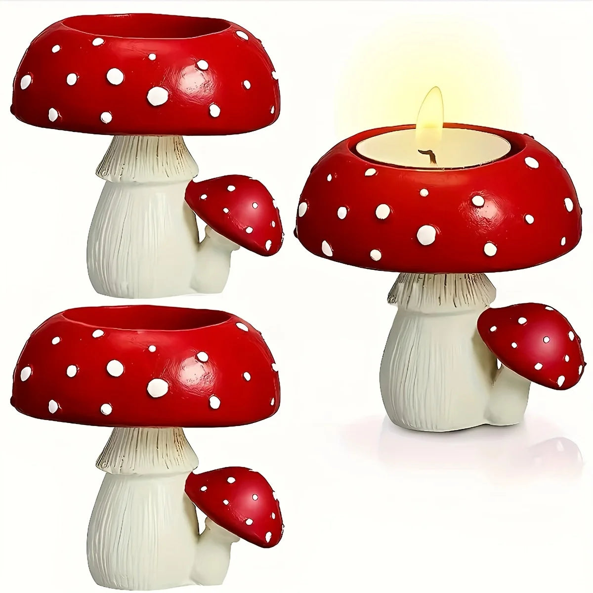 Three red and white polka dot mushroom-shaped candle holders on a white background.
