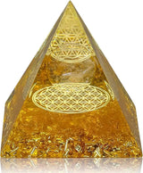 Gold pyramid with intricate patterns on a white background