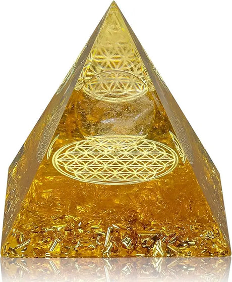 Gold pyramid with intricate patterns on a white background