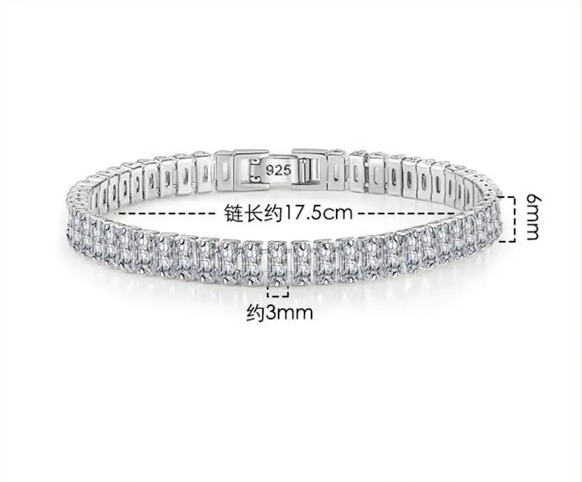 Silver bracelet with diamond accents on a white background