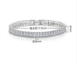 Silver bracelet with diamond accents on a white background