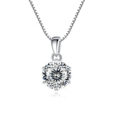 Silver necklace with a round diamond pendant on a white background