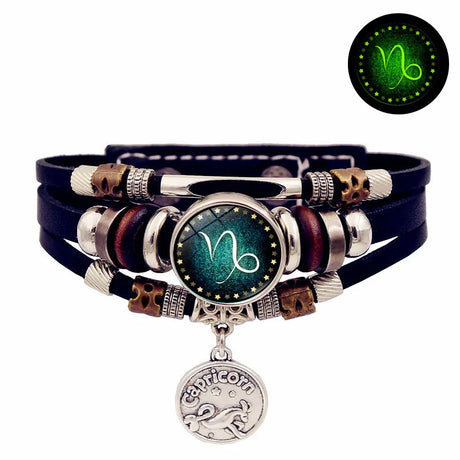 Multicolored leather bracelet with a zodiac charm on a white background