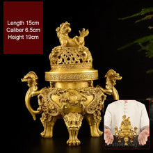 Gold-colored incense burner with intricate designs on a dark background