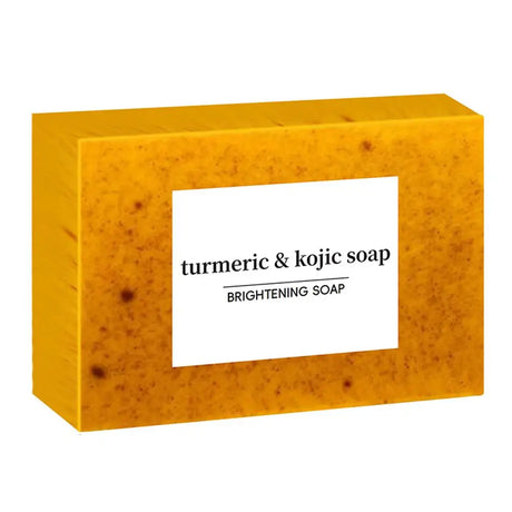 Turmeric and kojic soap bar in a yellow box with a white label.