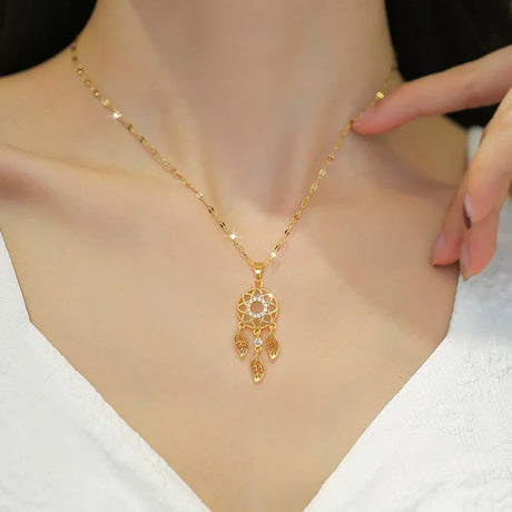 Gold necklace with a decorative pendant on a mannequin