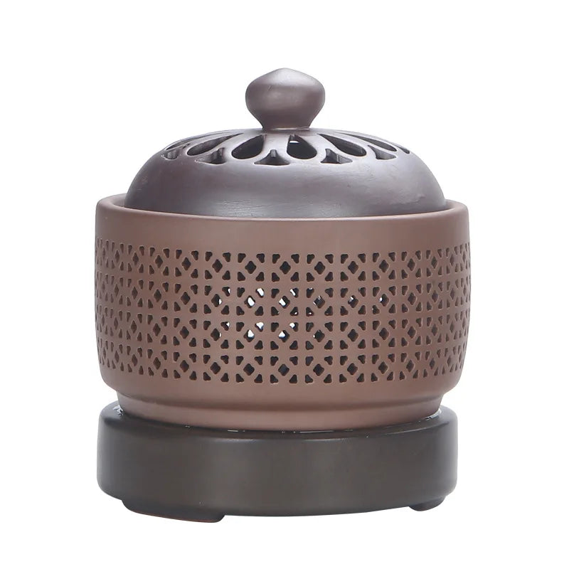 Ceramic diffuser with decorative lid on a white background