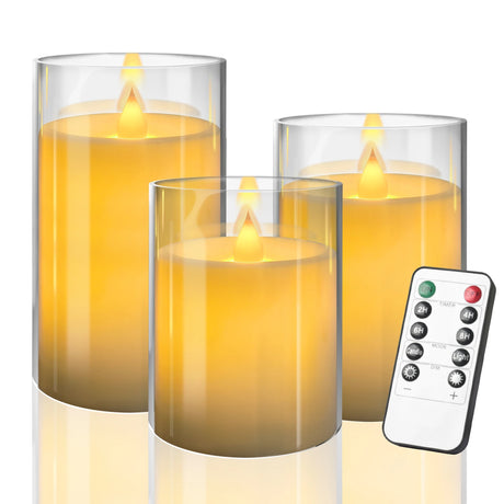Set of three flameless candles with a remote control on a white background