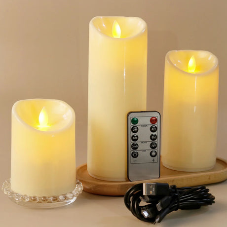Set of three flameless candles with a remote control on a wooden tray.