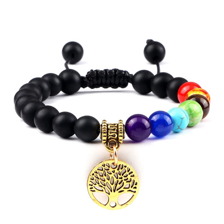 Black beaded bracelet with colorful beads and a gold tree of life charm on a white background