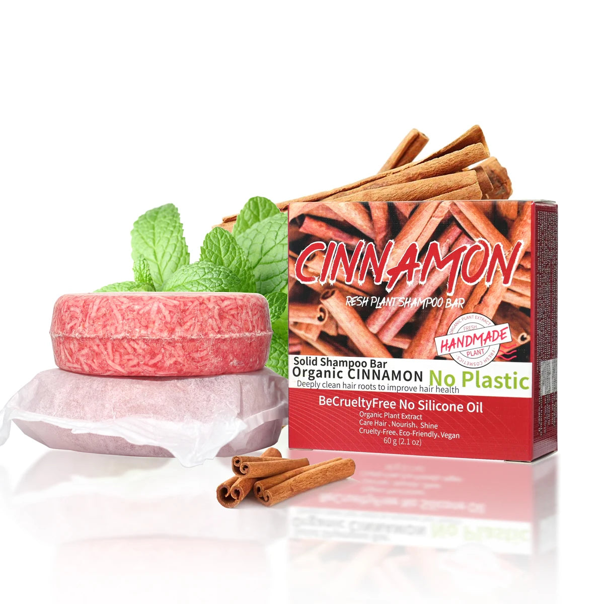Solid shampoo bar with organic cinnamon and mint leaves, next to a box labeled 'Cinnamon' on a white background.