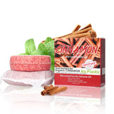 Solid shampoo bar with organic cinnamon and mint leaves, next to a box labeled 'Cinnamon' on a white background.