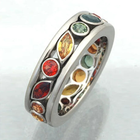 Ring with multicolored gemstones on a white background