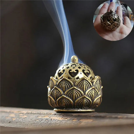 Bronze incense burner with intricate designs on a dark background