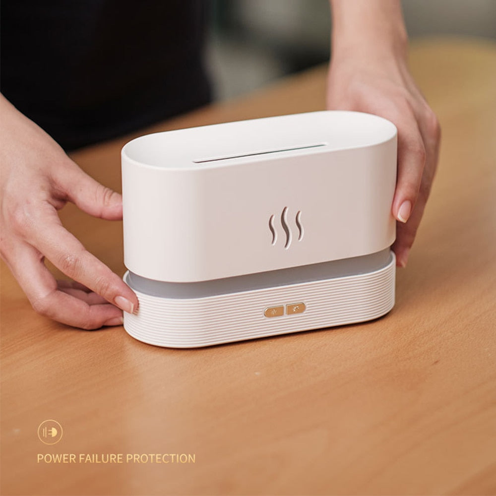 White humidifier with steam symbol on a wooden surface, hands holding it