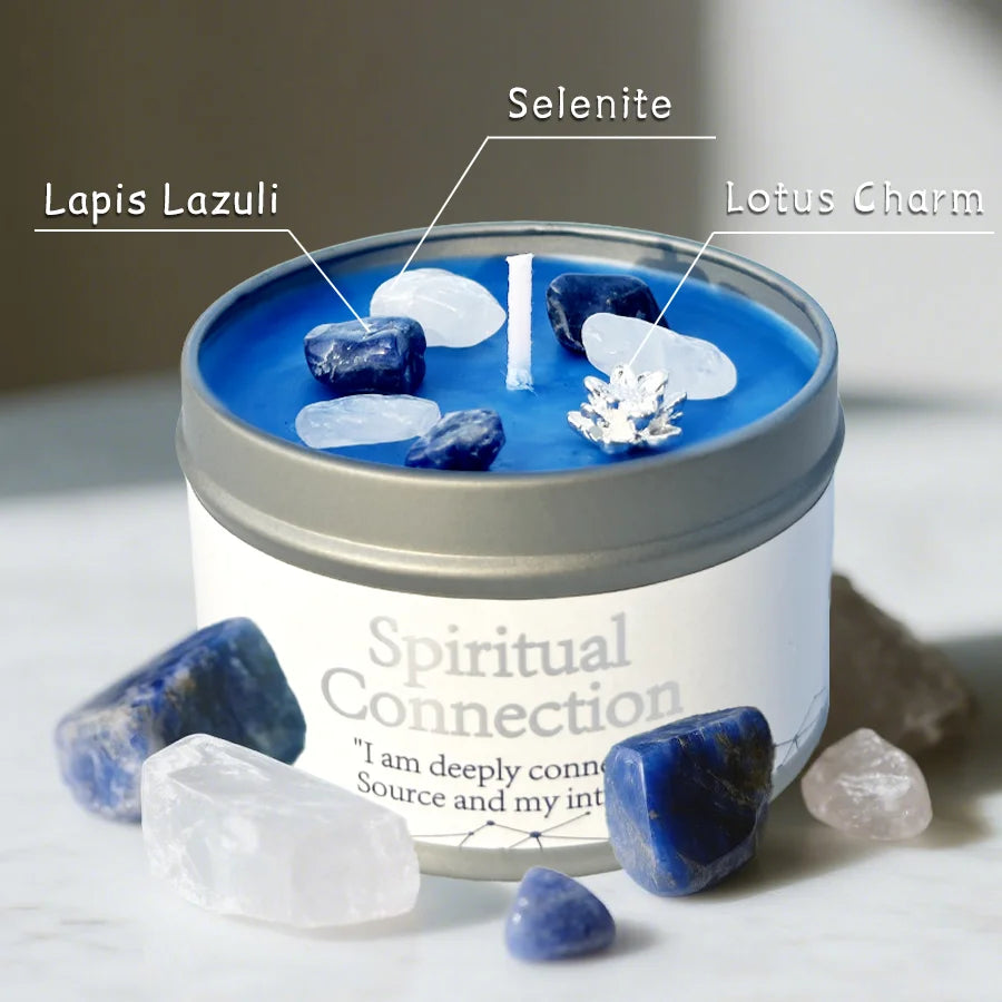 Blue candle in a tin labeled 'Spiritual Connection' with stones around it.