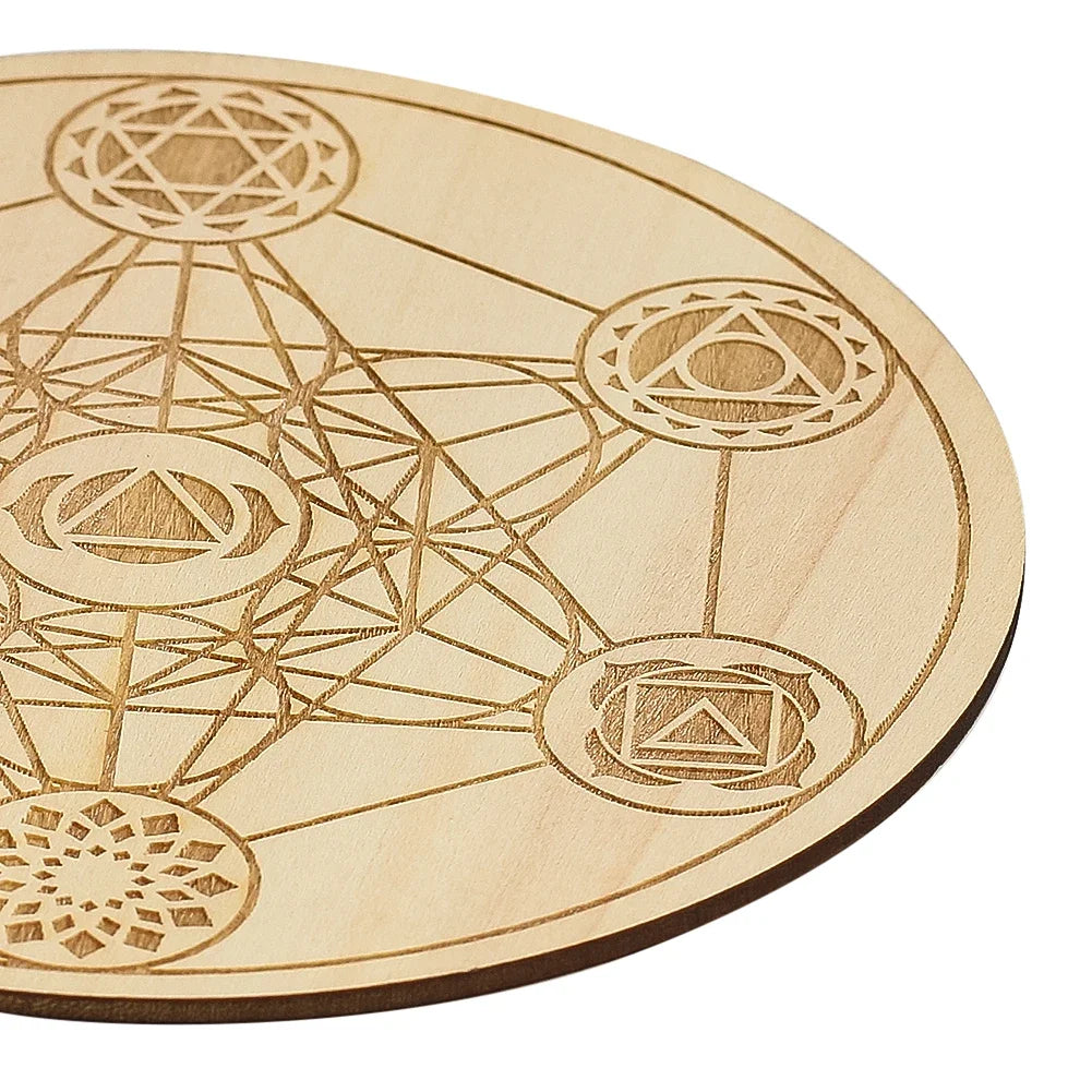 Wooden coaster with geometric laser-cut designs on a white background