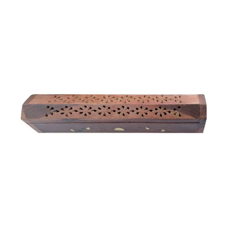 Wooden incense holder with intricate carvings on a white background