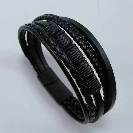 Black braided leather bracelet on a light gray background
