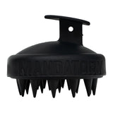 Black silicone scrubber with 'MANDATORY' branding on a white background